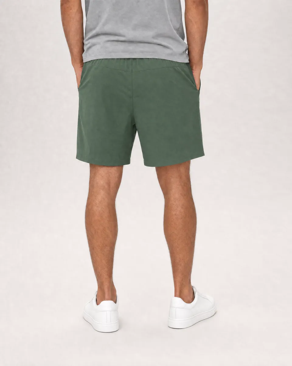 StringKing Men's Nylon Flex Game Shorts - Relaxed Fit, Green, Full Back - Human Model - Chest to Feet