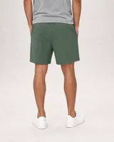 StringKing Men's Nylon Flex Game Shorts - Relaxed Fit, Green, Full Back - Human Model - Chest to Feet