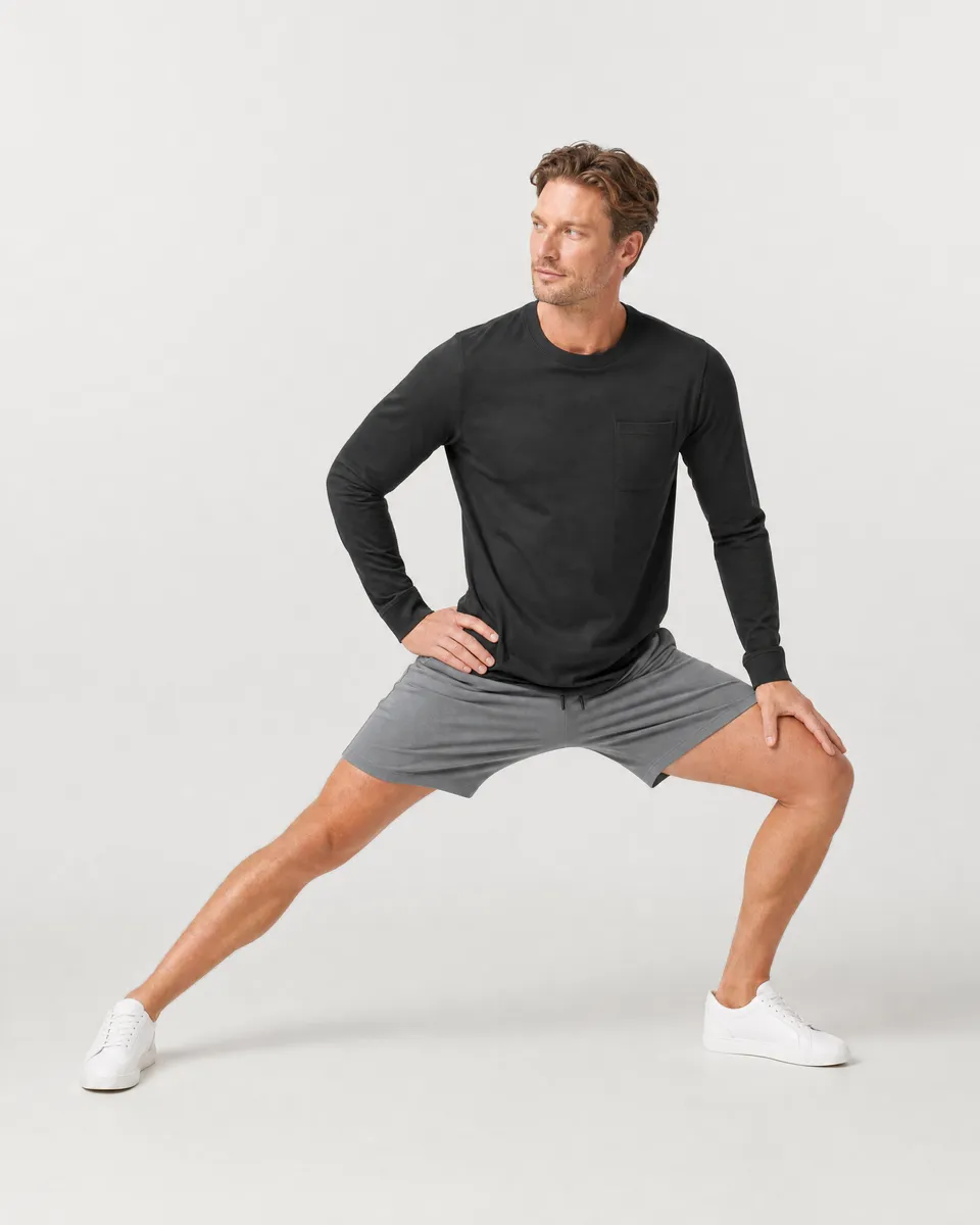 StringKing Men's Pima Jersey Long Sleeve Pocket Tee - Relaxed Fit, Black, Full Front Angle - Human Model